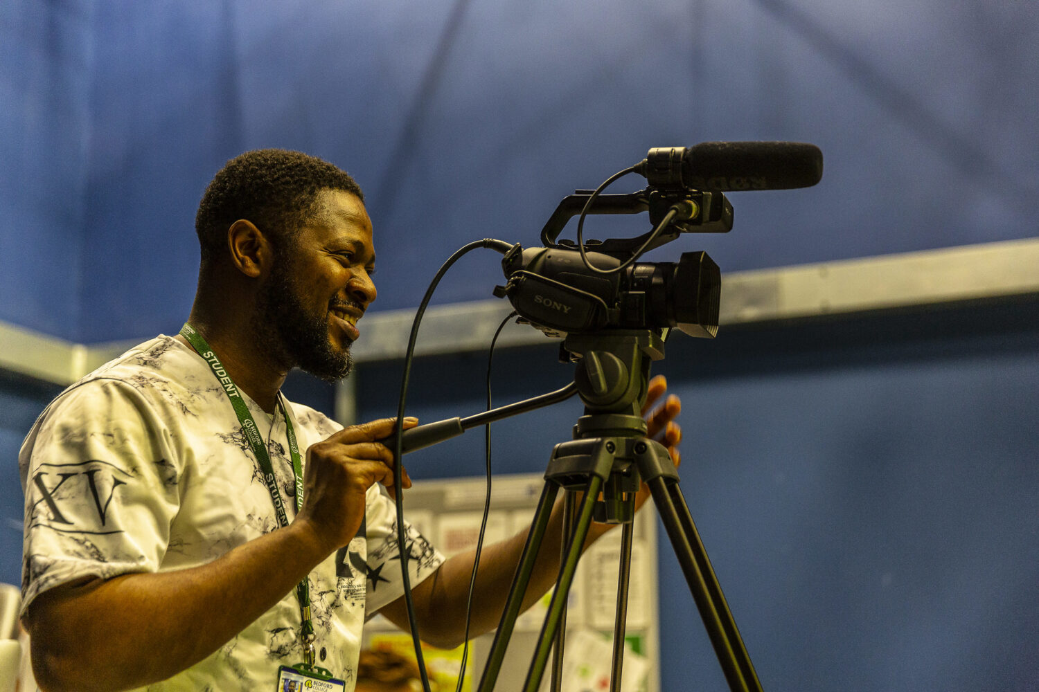 Media student with camera filming Bedford College