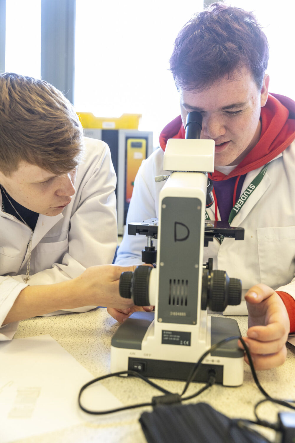 Science student with microscope Tresham College