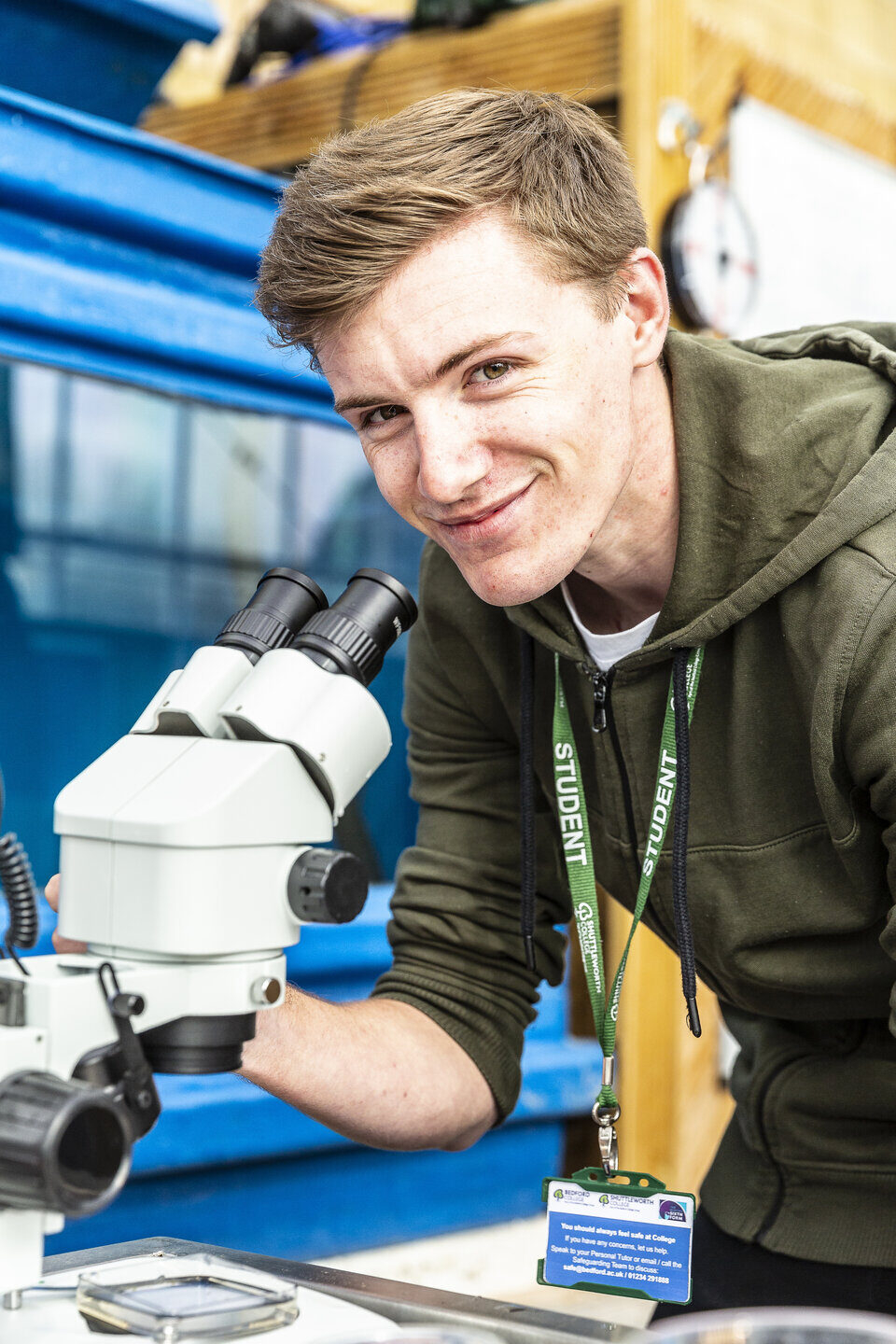 Fish Management student with microscope Shuttleworth College
