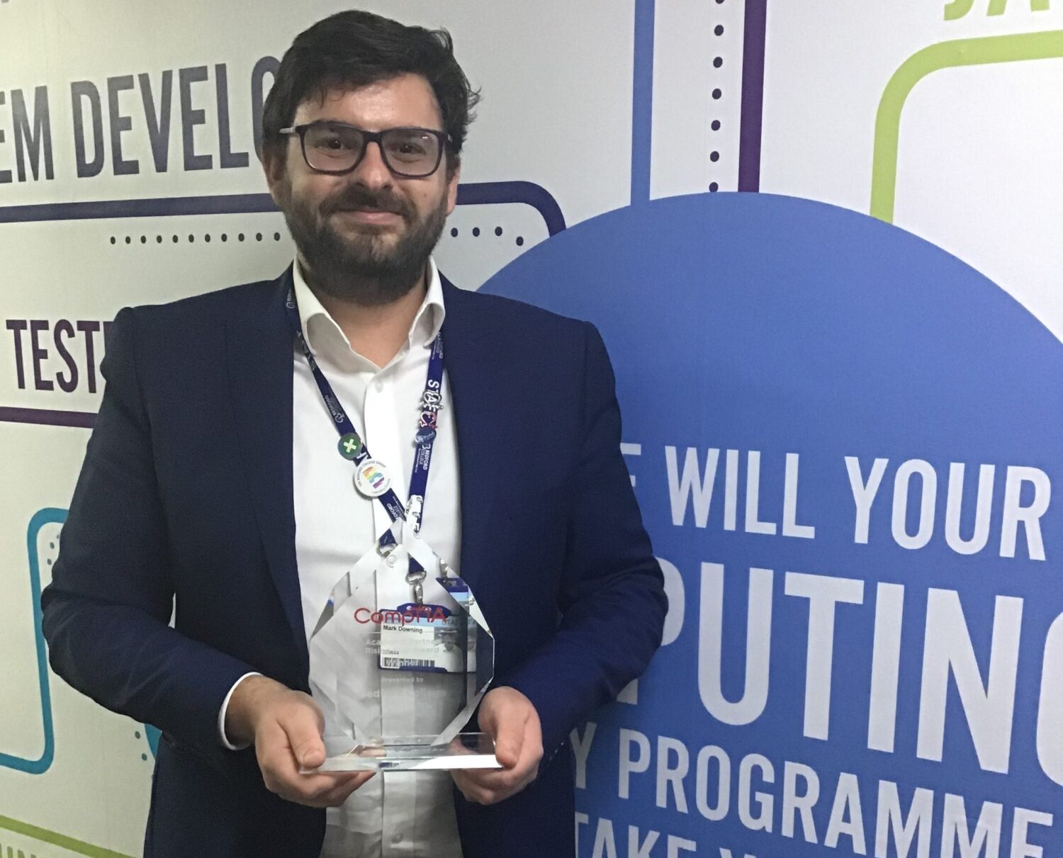 Bedford College Computing tutor Mark Downing with award